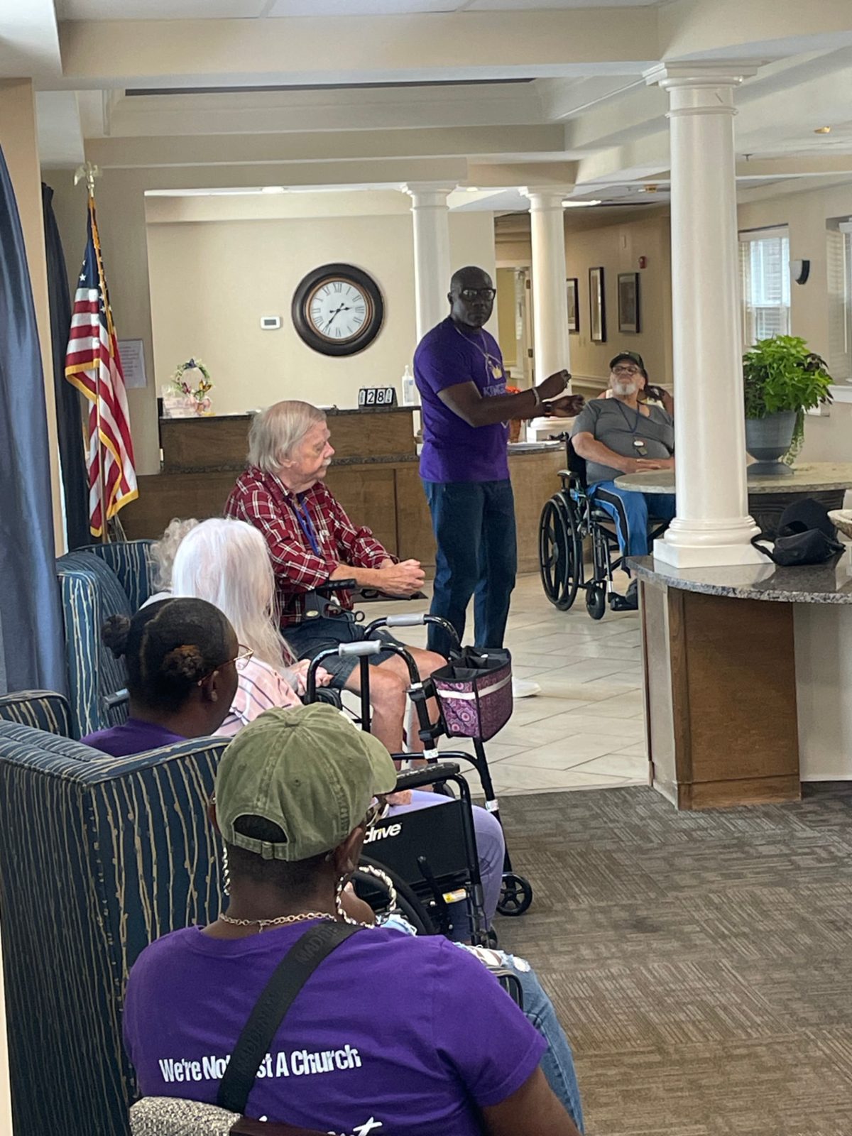 Kingdom Cultural Center volunteers spending time with nursing home residents.