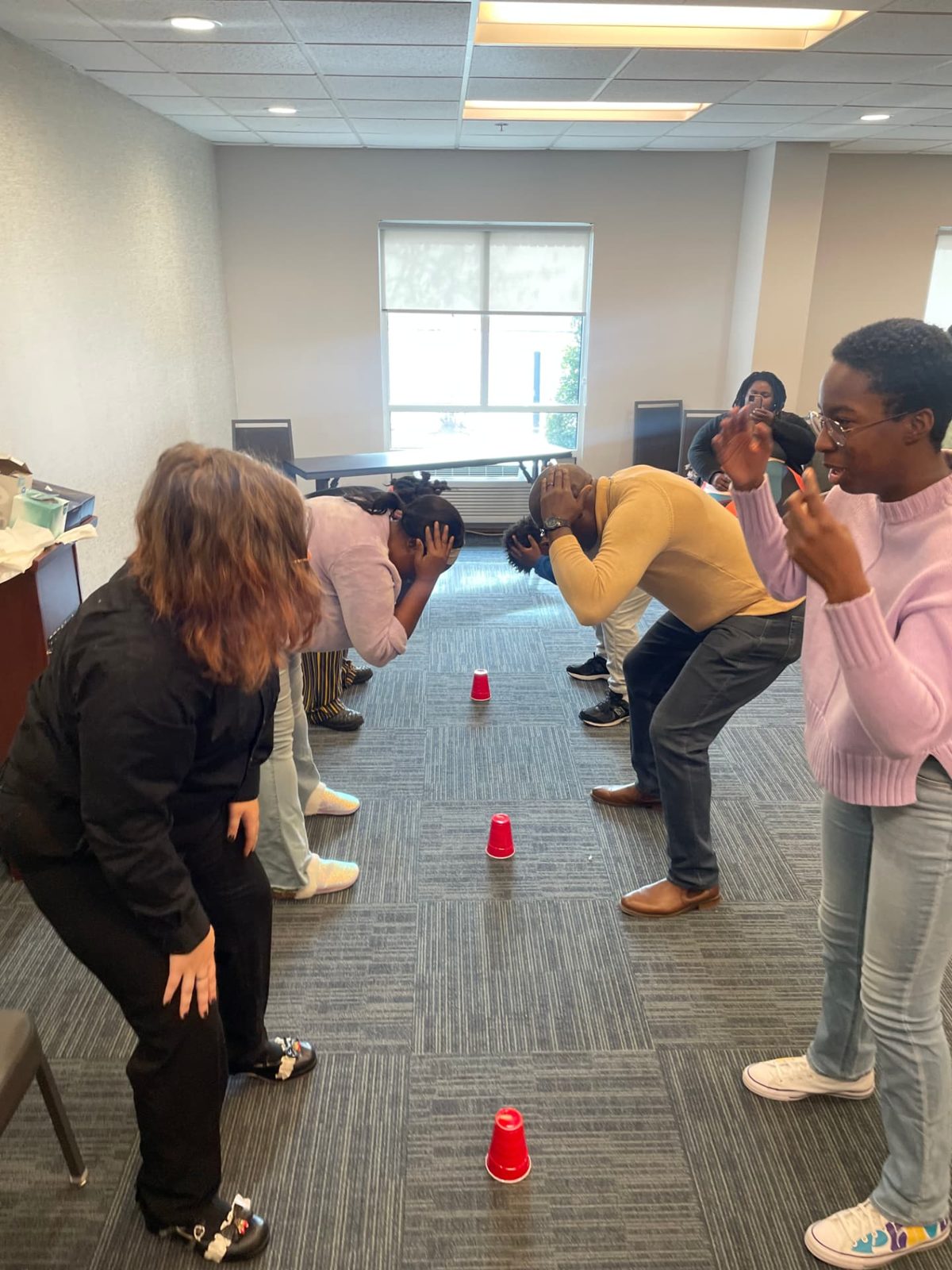 Members playing a group game together during a fellowship game day.